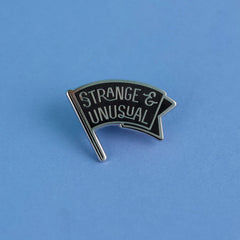 Strange & Unusual Enamel Pin | Dragon's Lair Comics and Fantasy Houston TX